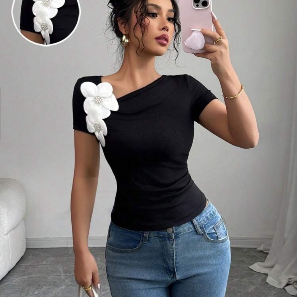 Elegant Black Top with White Floral Detail